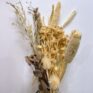 close up of Dried Natural Flowers in a Rustic Bouquet on white background