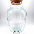 Elegant glass jar with cork lid, perfect for storage or decorative display.