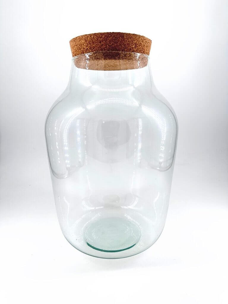 Elegant glass jar with cork lid, perfect for storage or decorative display.