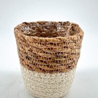 Two-toned wicker basket with plastic lining, contrasting natural brown and light woven design.