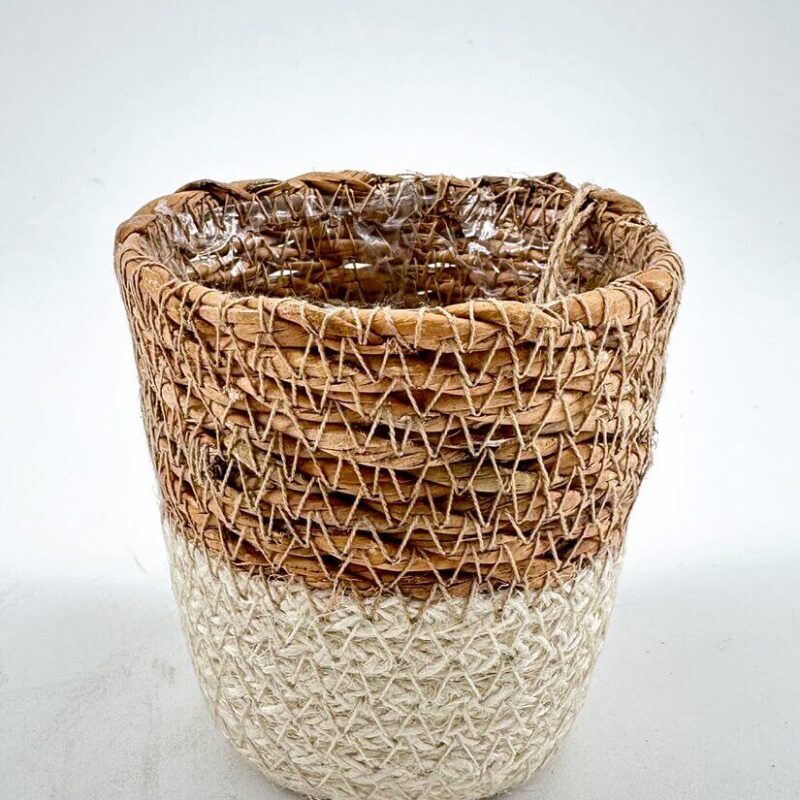 Basket Planter Two-toned wicker basket with plastic lining, contrasting natural brown and light woven design.
