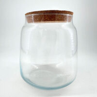 Elegant glass jar with cork lid, perfect for storage or decorative display.