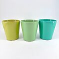 Colourful ceramic cups in vibrant green and turquoise, perfect for home decor or beverages.