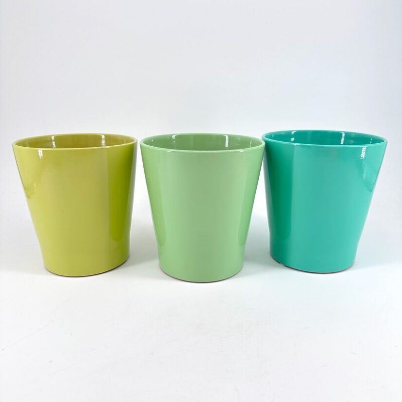 Vibrant Colourful Cups for Stylish Home Decor Colourful ceramic cups in vibrant green and turquoise, perfect for home decor or beverages.