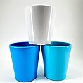 Stylish turquoise and white cup arrangement showcasing modern design and vibrant colours.
