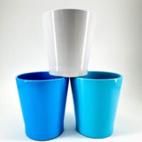 Stylish turquoise and white cup arrangement showcasing modern design and vibrant colours.