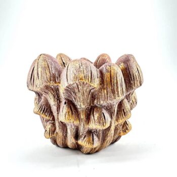 Sculpture of earthy-toned mushroom cluster highlighting natural textures and intricate organic design.