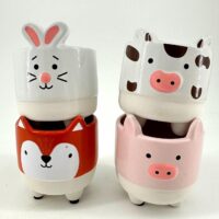 Animal-shaped decorative pots featuring rabbit, cow, fox, and pig designs for whimsical home décor.