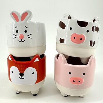 Animal-shaped decorative pots featuring rabbit, cow, fox, and pig designs for whimsical home décor.