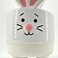 Ceramic bunny figurine with glossy finish, large eyes, pink nose, and whimsical design.