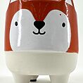 Charming ceramic fox planter with orange accents, ideal for succulents or decorative storage.