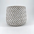 Stylish concrete chevron planter, perfect for indoor or outdoor greenery display.