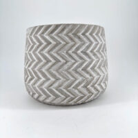 Stylish concrete chevron planter, perfect for indoor or outdoor greenery display.