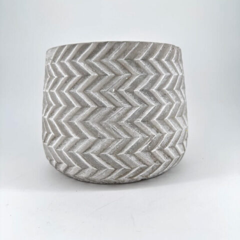 Stylish concrete chevron planter, perfect for indoor or outdoor greenery display.