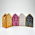 Charming ceramic house figurines in vibrant colours, perfect for home decor and nostalgic collections.