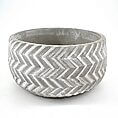 Stylish concrete chevron planter, perfect for indoor or outdoor greenery display.