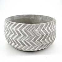 Stylish concrete chevron planter, perfect for indoor or outdoor greenery display.
