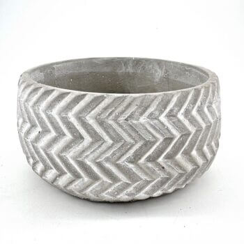 Stylish concrete chevron planter, perfect for indoor or outdoor greenery display.