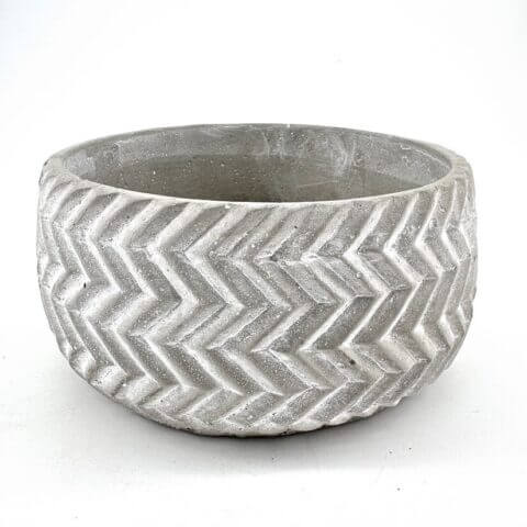 Stylish concrete chevron planter, perfect for indoor or outdoor greenery display.