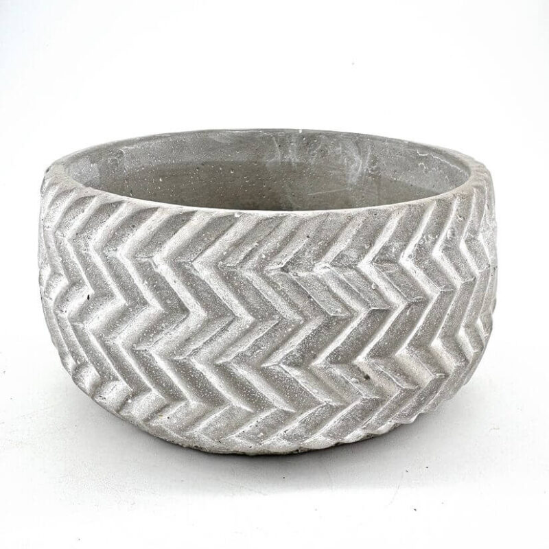 Stylish concrete chevron planter, perfect for indoor or outdoor greenery display.