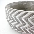 Stylish concrete planter with herringbone pattern, perfect for modern gardens or interiors.