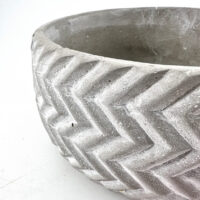 Stylish concrete planter with herringbone pattern, perfect for modern gardens or interiors.