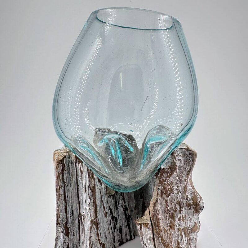 Elegant glass and wood art piece, featuring a textured aqua vessel on a sculptural base.
