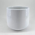 Elegant white ceramic pot with a glossy finish, perfect for modern decor or planting.