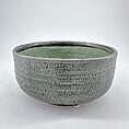 Elegant ceramic bowl in gray and green glaze, perfect for modern minimalist decor.