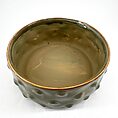 Elegant ceramic bowl in muted green with golden edge and unique textured design.