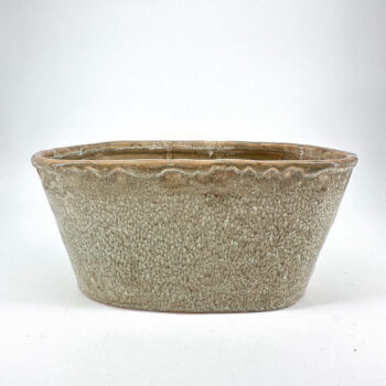 Rustic ceramic pot with textured beige surface and elegant wavy rim for decorative use.