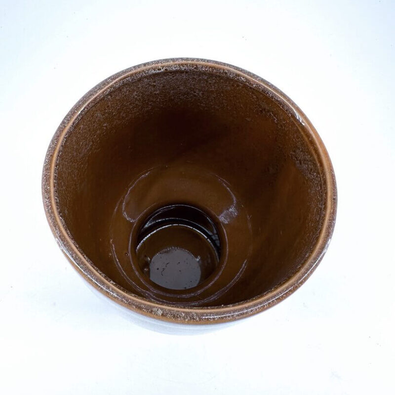 Artisan Brown Ceramic Bowl with Glossy Finish Elegant brown ceramic bowl with a glossy finish, showcasing unique artisan craftsmanship.