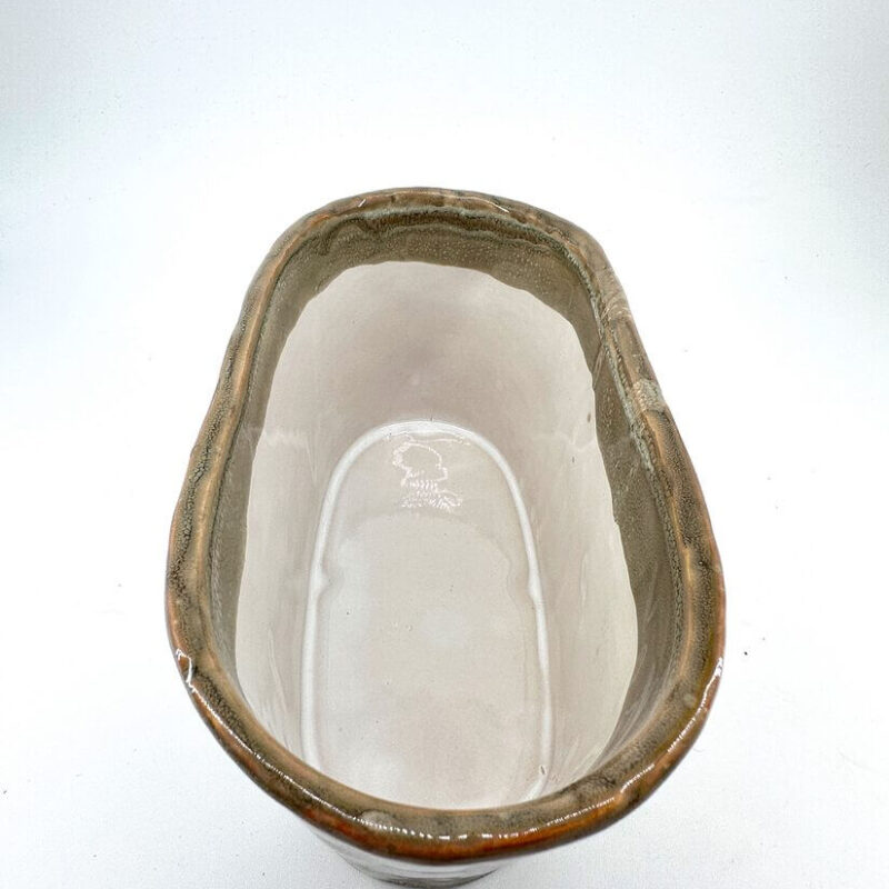 Elegant Handmade Ceramic Bowl with Glossy Finish Elegant ceramic bowl with rustic tan glaze and glossy beige interior, perfect for decor or use.