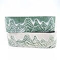 Stylish mountain-themed ceramic pots in green and beige, perfect for home decor and plant displays.