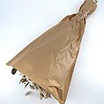 Beautifully wrapped dried flower bouquet in rustic kraft paper, tied with twine.