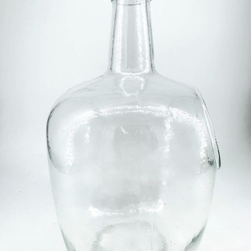 Elegant Clear Glass Bottle with Cork Stopper Clear glass bottle with cork stopper, perfect for storage or decorative use.