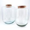 Elegant glass jars with cork lids, perfect for storage or decorative home styling.