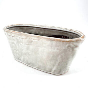 Elegant gray ceramic planter, perfect for indoor or outdoor plants, blending functionality with artistry.