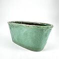 Elegant turquoise ceramic planter with glossy finish, perfect for modern home and garden decor.
