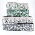 Stacked mountain planters with unique designs in various colours, adding a natural touch to decor.