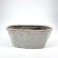 Elegant modern gray ceramic pot with glossy glaze, perfect for indoor plants or succulents.