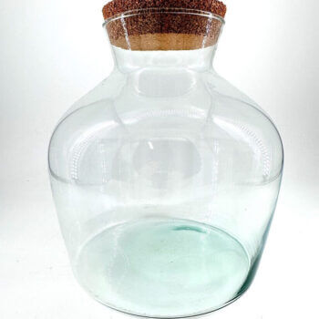 Elegant glass jar with cork lid, perfect for storage or decorative use in any setting.