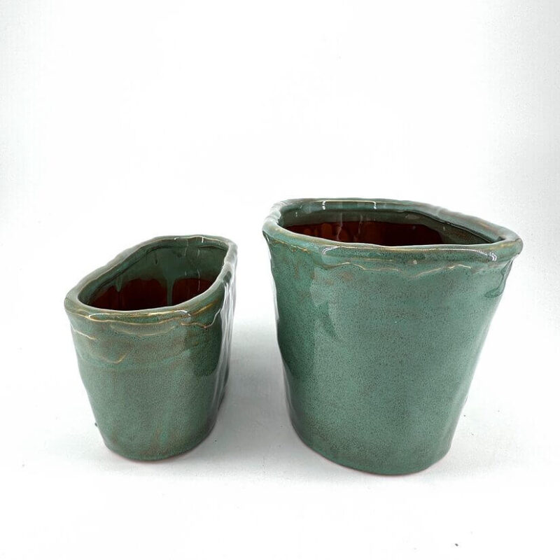 Artisanal Turquoise Ceramic Pots for Elegant Décor Handcrafted ceramic pots with turquoise glaze, showcasing unique textures and rustic charm.