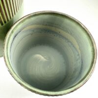 Ceramic bowl and vessel with aqua glaze, showcasing artisan craftsmanship and elegant design.