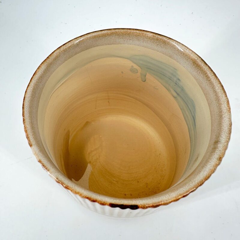 Handcrafted Artisan Ceramic Bowl with Earthy Tones Handcrafted ceramic bowl, top view, showcasing earthy tones and unique artisan details.
