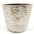 Rustic clay planter with textured surface and coastal aesthetic, suitable for various plants.