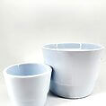 Modern light blue ceramic pots on a neutral background, showcasing elegance and contemporary design.