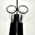 Modern test tube holder with two glass tubes on sleek black base, minimalist design.