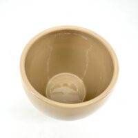 Beige glossy ceramic bowl with elegant design and versatile functionality for decor or serving.