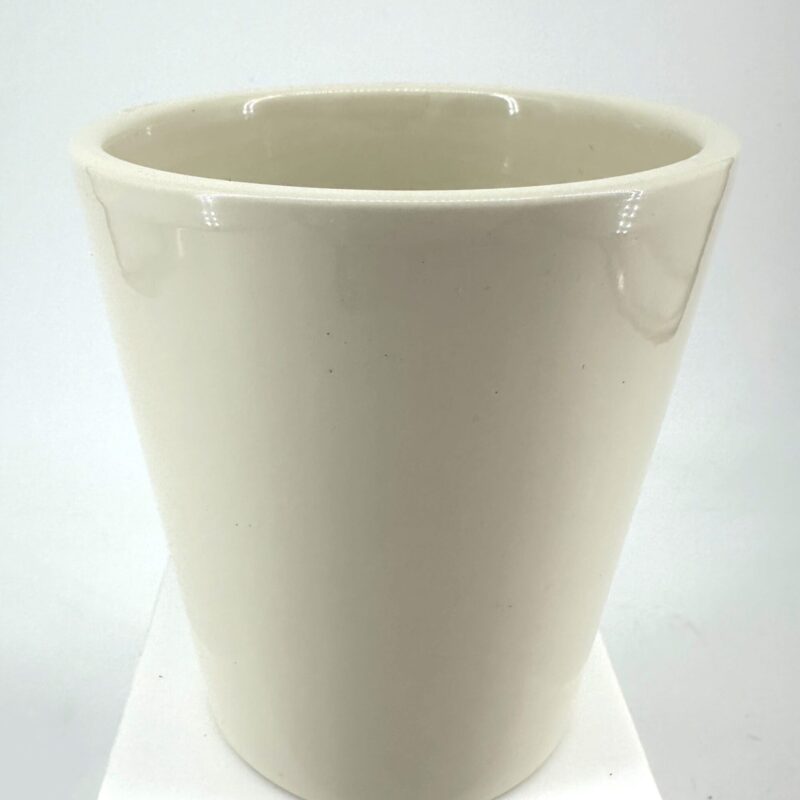 Elegant tapered white ceramic pot with glossy finish on a white pedestal.